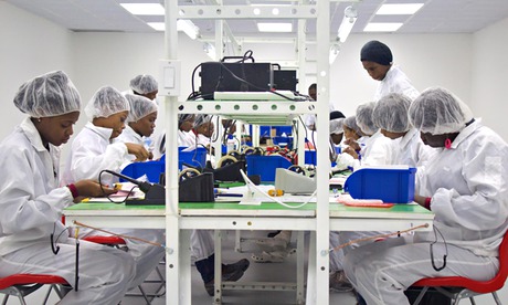 MDG : Workers on Surtab tablets PC assembly line in Industrial Park of Port-au-Prince, Haiti